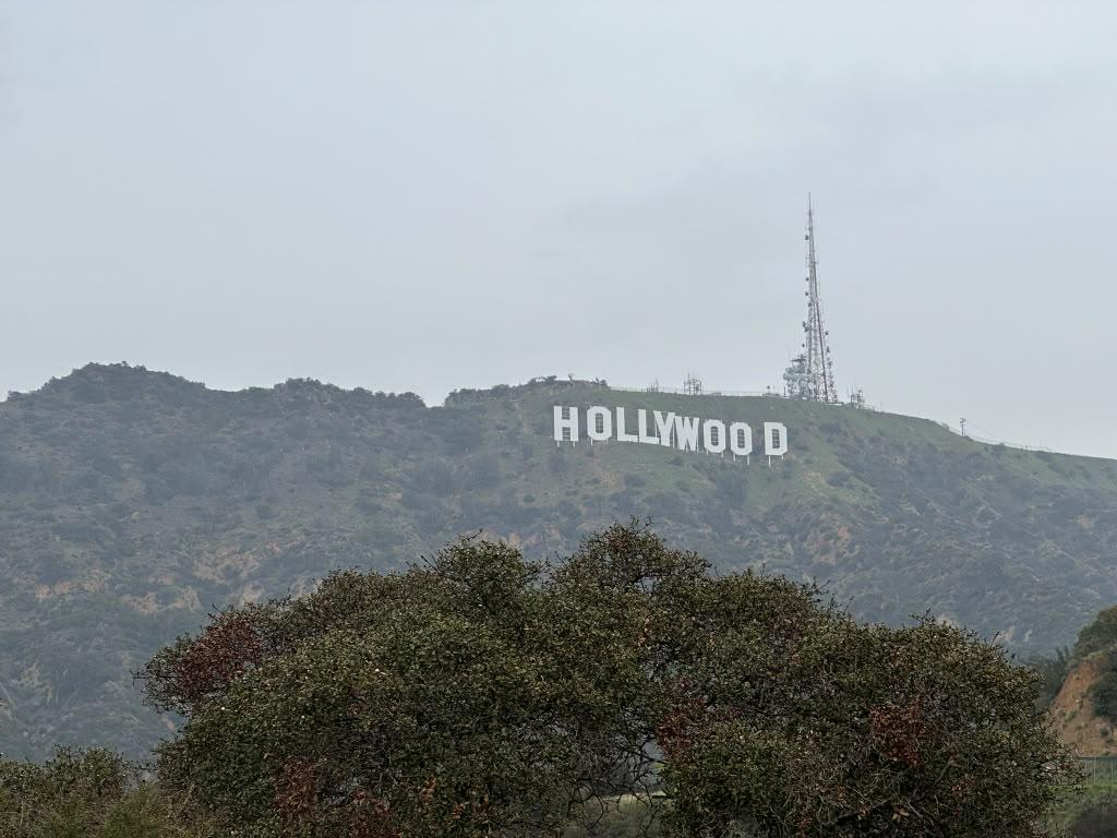 Hollywood Sign across the hazy Los Angeles hills