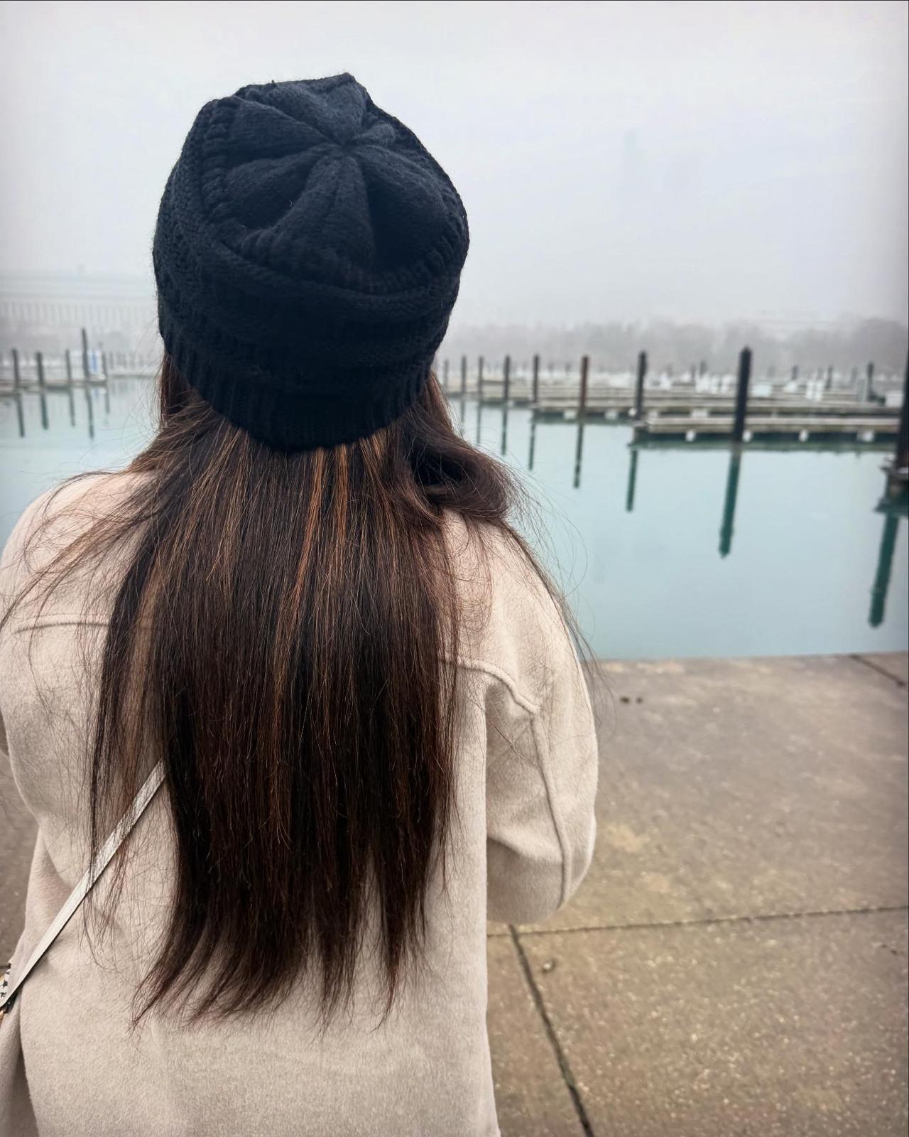 Traveller looking across foggy Lake Michigan near Navy Pier