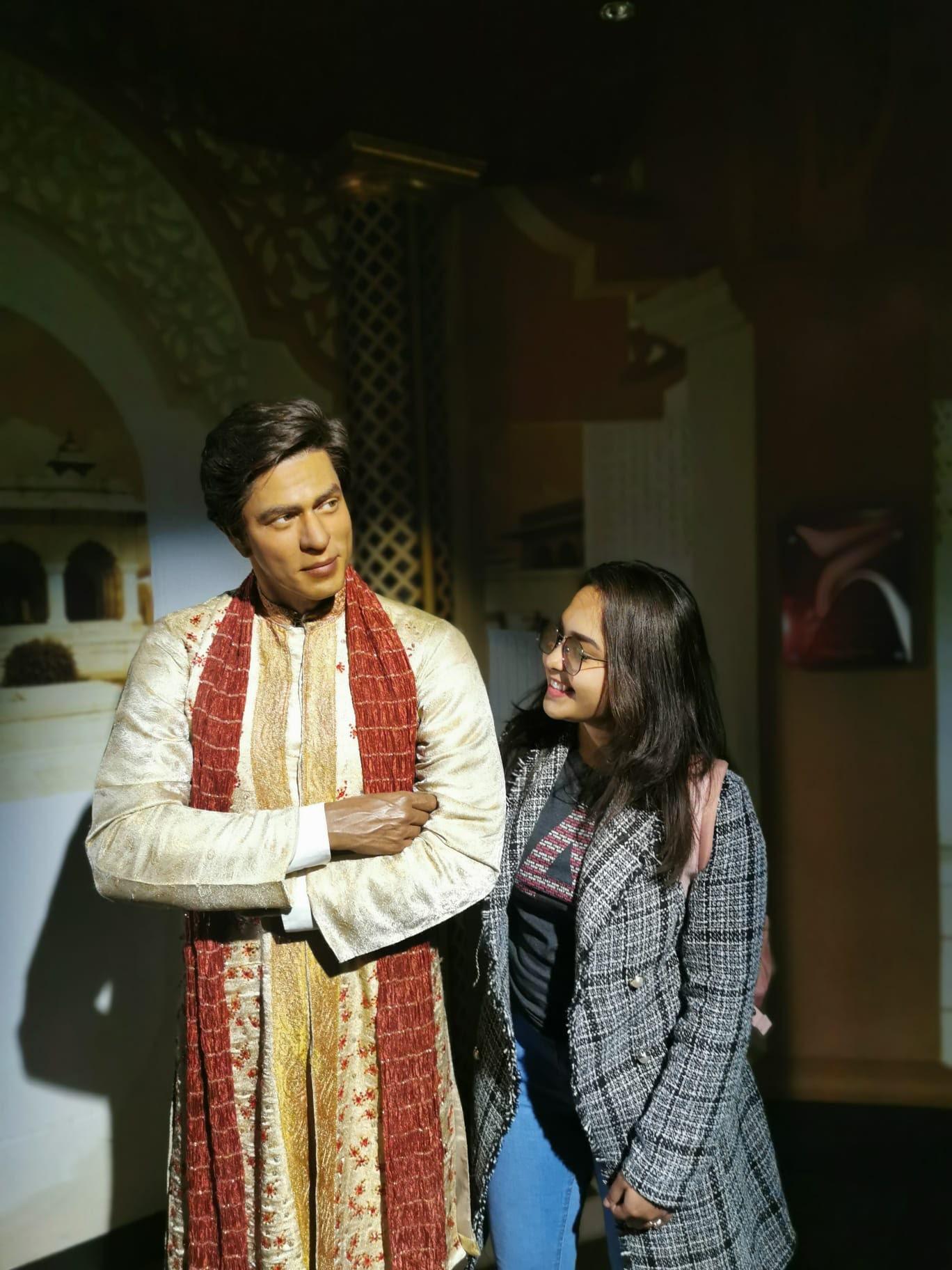 Personal portrait beside a ceremonial wax figure