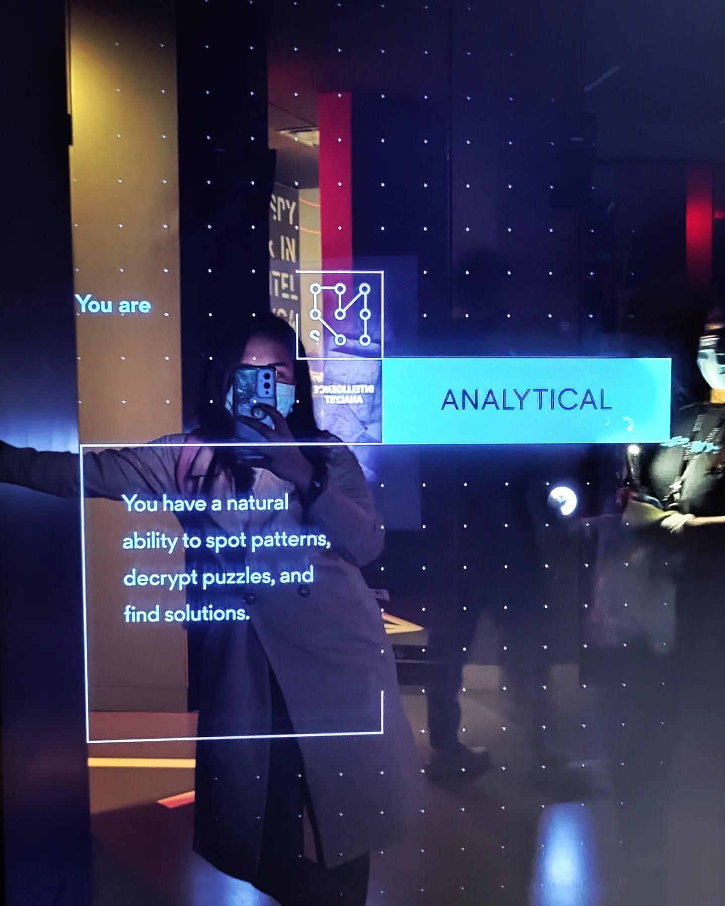 Interactive analytical challenge screen at a spy-themed attraction