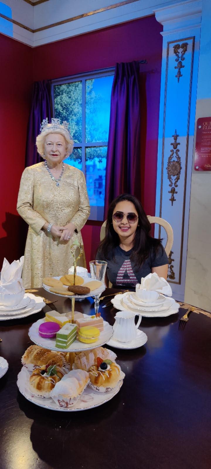 Personal portrait at an afternoon-tea-style wax display