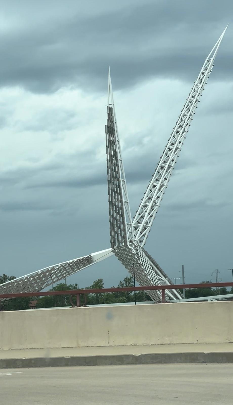 Oklahoma City pedestrian bridge viewed during a cloudy daytime drive