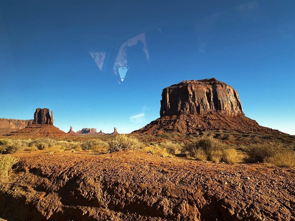Monument Valley butte viewed through a vehicle window on arrival