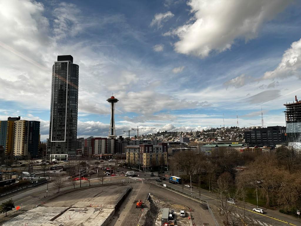 Seattle skyline and Space Needle viewed beneath dramatic clouds