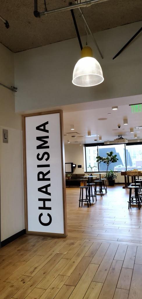 Bright indoor space with a large Charisma sign