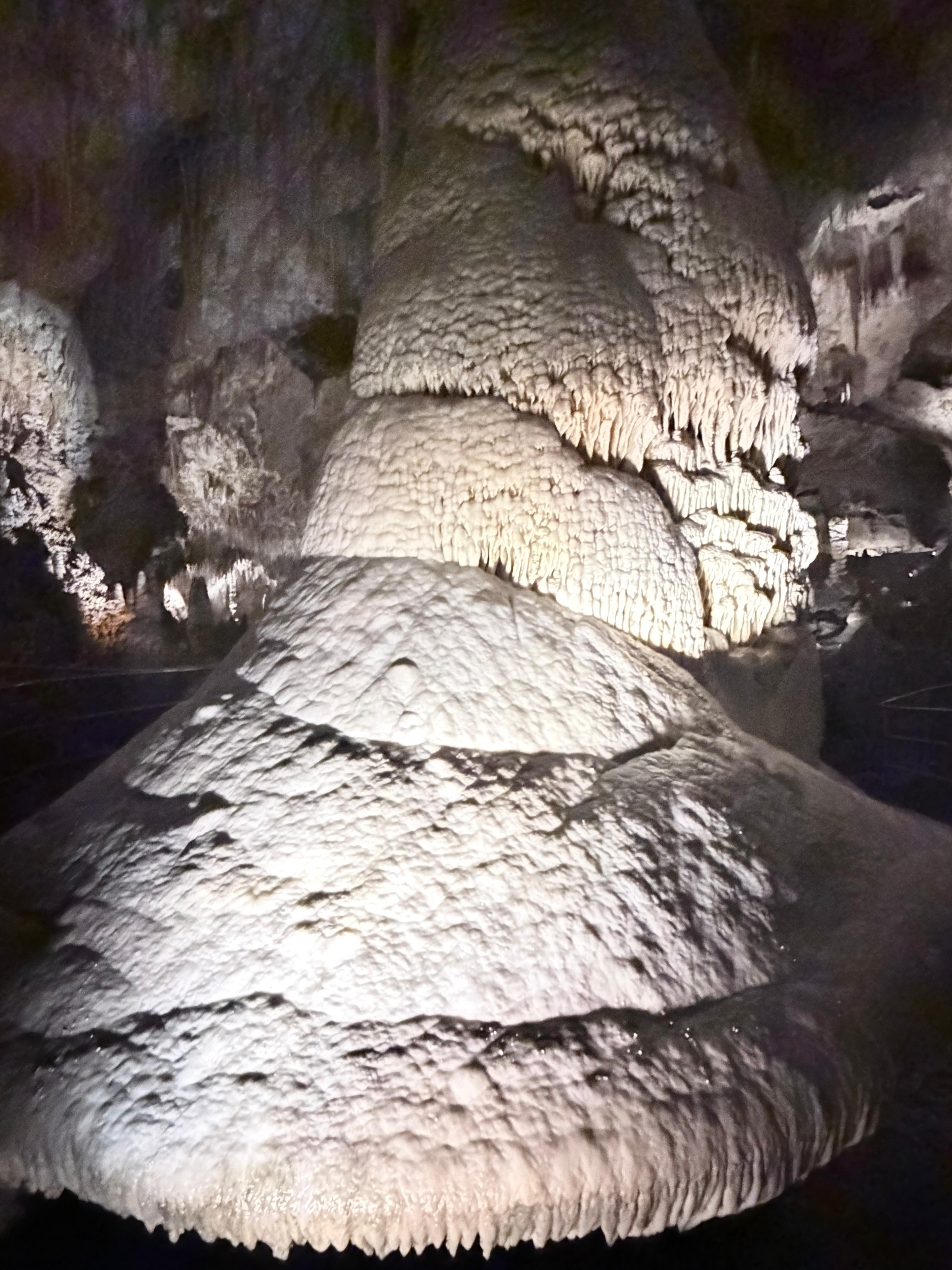 Large rounded cave formation with layered mineral texture